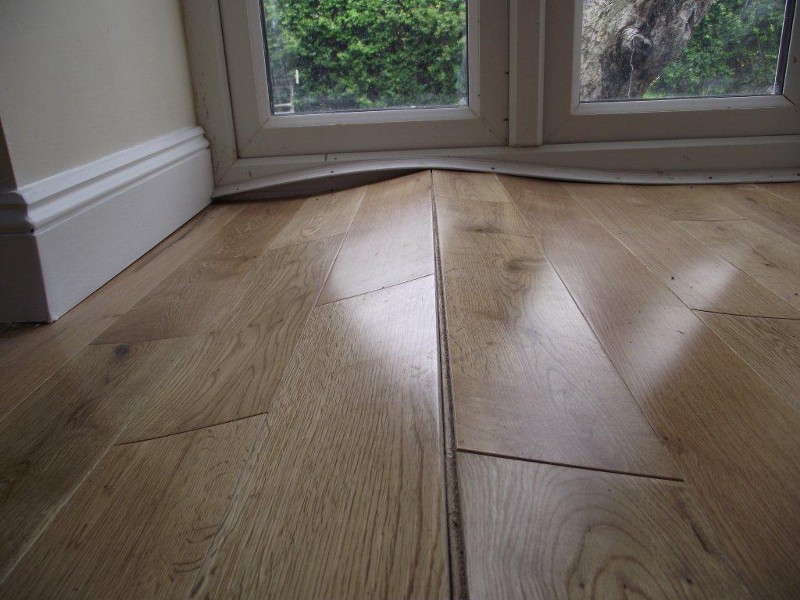 Warped Floorboards Caused By Humidity Swings Woodfloordoctor Com